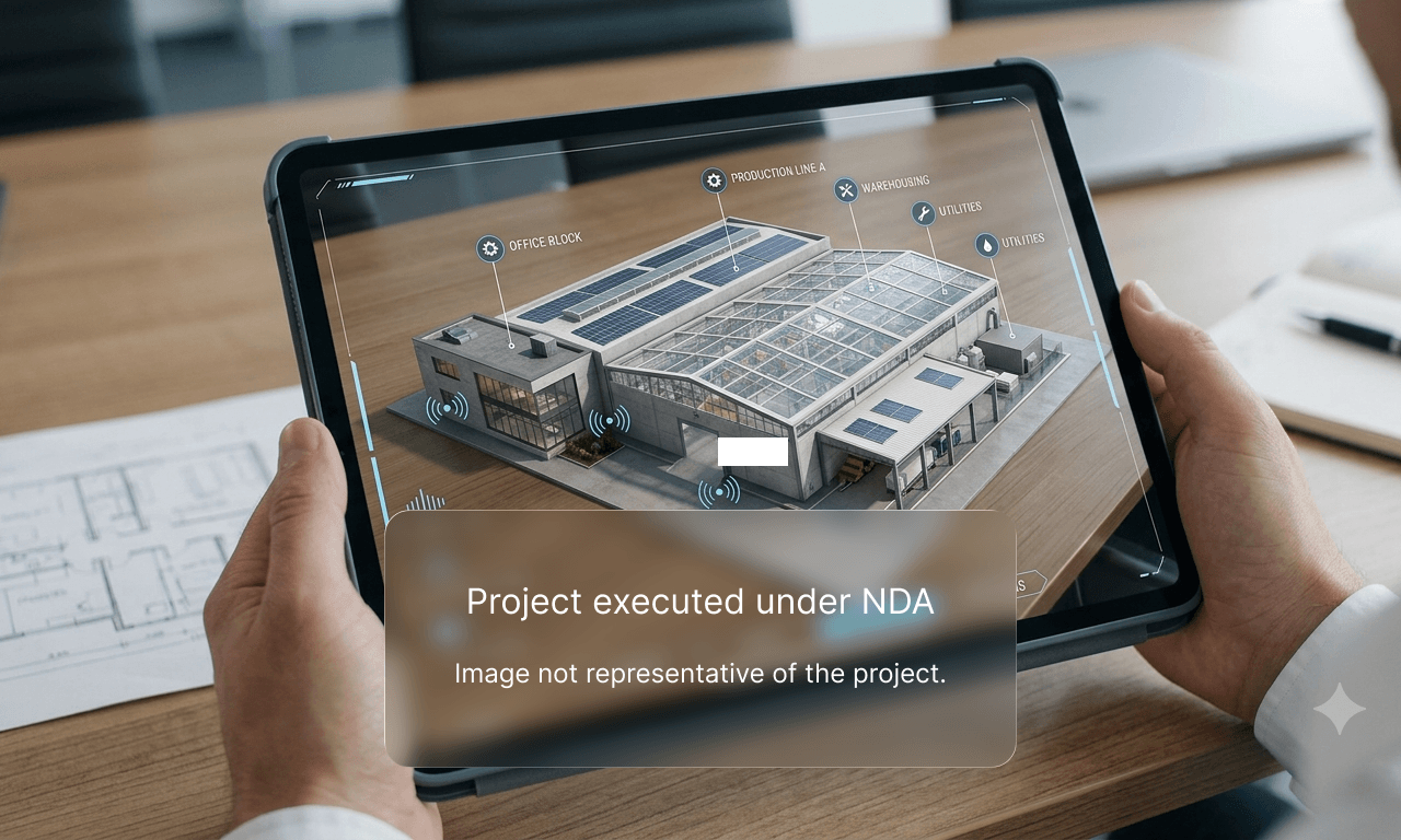 Hands holding a tablet that displays an interactive 3D digital twin of a manufacturing facility, with a semi-transparent NDA disclaimer box overlaying the lower portion of the screen.